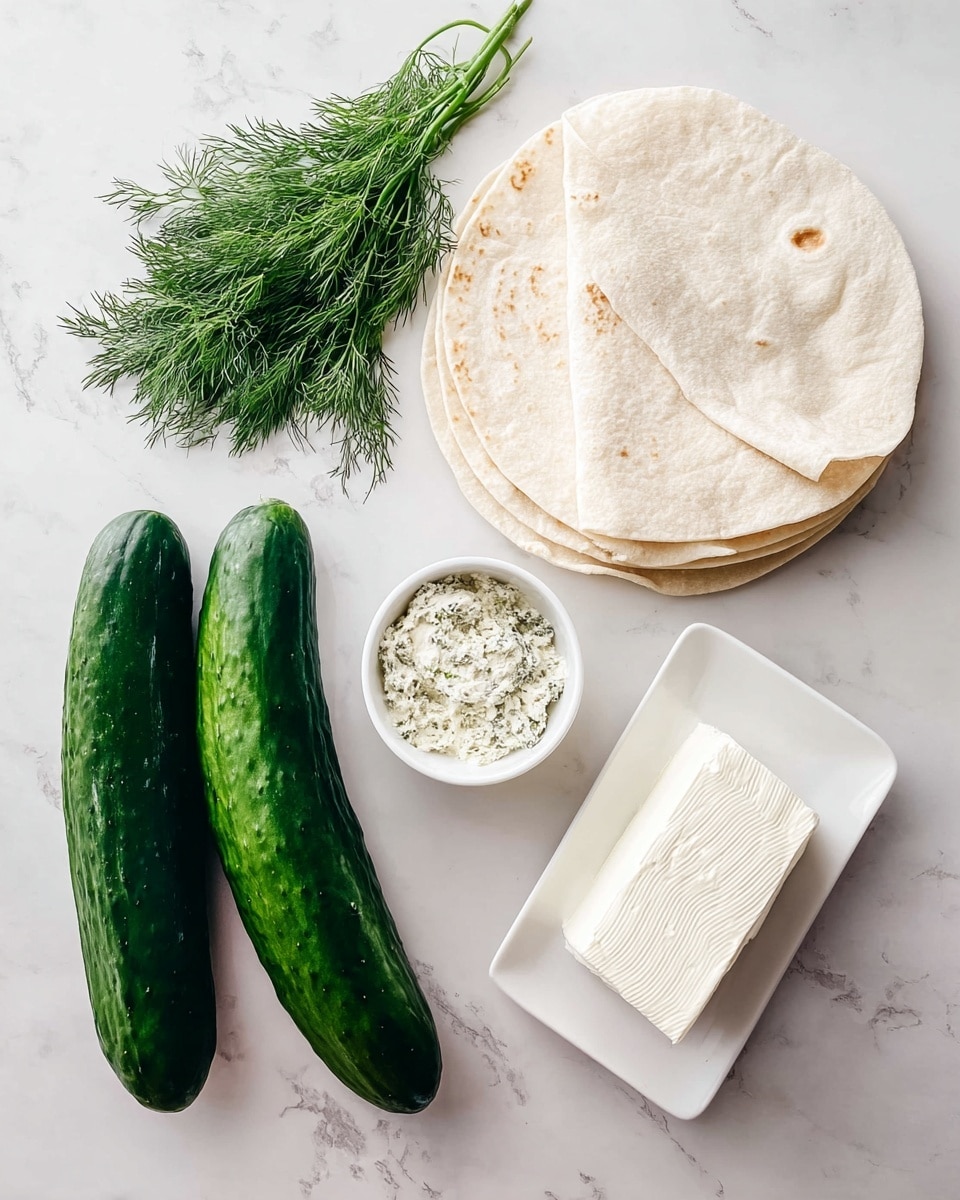 A white plate holds a stack of small pinwheel sandwiches, each cut into thick slices held together with toothpicks. Each pinwheel has three visible layers: the outer light beige tortilla wrap, a smooth white creamy layer inside, and thin strips of fresh green cucumber rolled tightly within. In the background, there is a white bowl filled with sliced cucumber rounds, and some leafy green herbs are slightly out of focus on a white marbled surface. The image is brightly lit, showing fresh and clean textures. Photo taken with an iphone --ar 4:5 --v 7