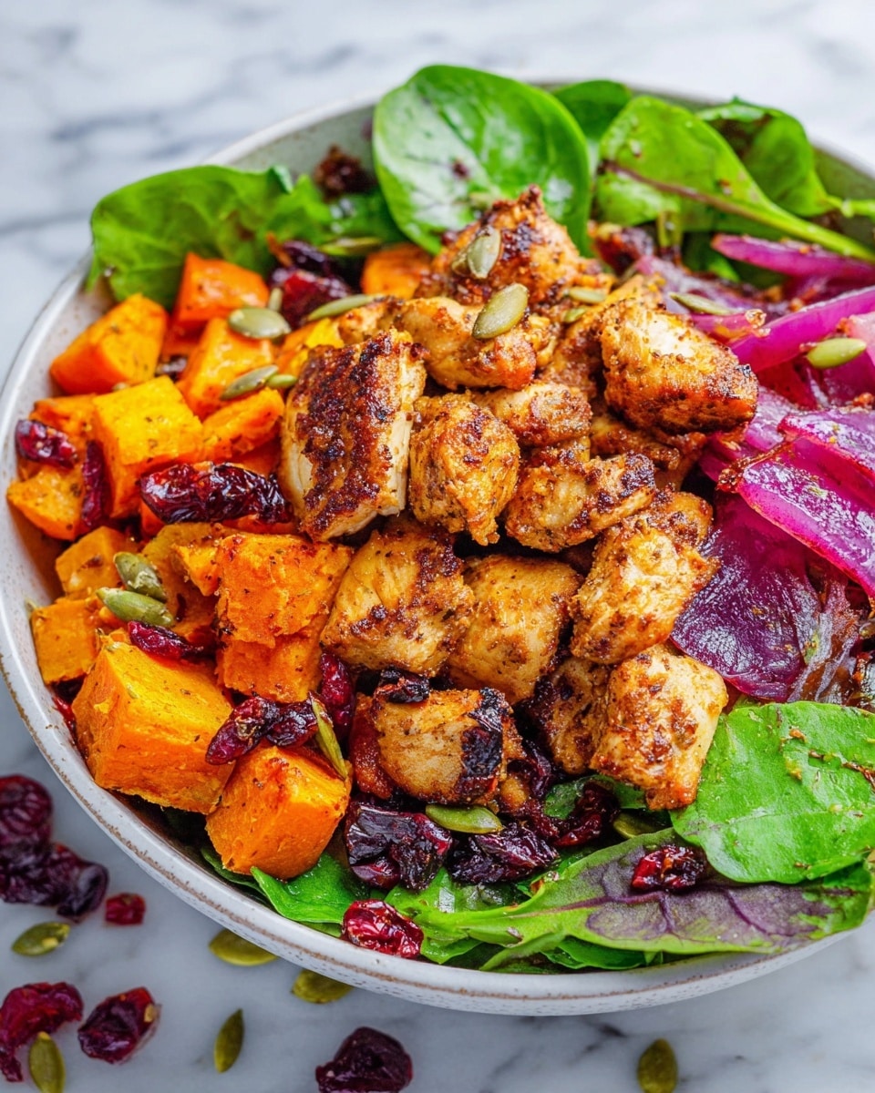 The image shows a close-up of a cooked dish featuring several thick slices of grilled chicken breast with dark grill marks, spread evenly across the scene. Mixed with the chicken are chunky pieces of roasted orange sweet potatoes and large wedges of soft purple-red onions, all slightly caramelized. Bright green cilantro leaves are scattered over the top, adding freshness and contrast. The food rests directly on a white marbled texture surface, making the warm colors of the dish stand out. photo taken with an iphone --ar 4:5 --v 7