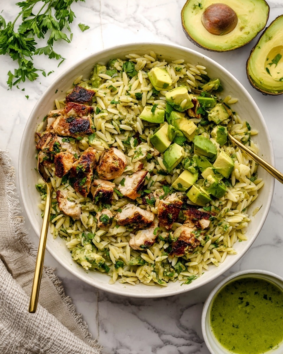 A white bowl on a white marbled surface holds a dish divided into four sections. The first section contains diced avocado pieces in light green shades with smooth texture. The second section shows cooked orzo pasta in pale yellow, soft and slightly glossy. The third section features chopped green onions in vibrant green color with a crisp texture. The fourth section is filled with grilled chicken chunks that are brown with char marks and a juicy texture. Two halves of an avocado are placed on the white marbled surface near the bowl, and a small glass jar with green sauce is partially visible at the bottom right corner. Photo taken with an iphone --ar 4:5 --v 7