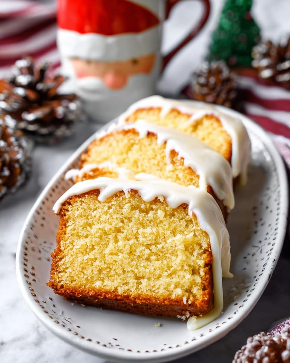 The image shows a loaf cake with a smooth, thin white icing layer covering its top and sides, positioned on a wooden board with parchment paper underneath. The cake is sliced to reveal three thick pieces stacked one behind the other, each with a moist, crumbly light golden yellow interior and a slightly darker brown crust etched around the edges. Around the board, there are cinnamon sticks, whole nutmegs, and cloves, with two glass jars filled with a creamy light yellow substance in the blurred white marbled background. photo taken with an iphone --ar 4:5 --v 7