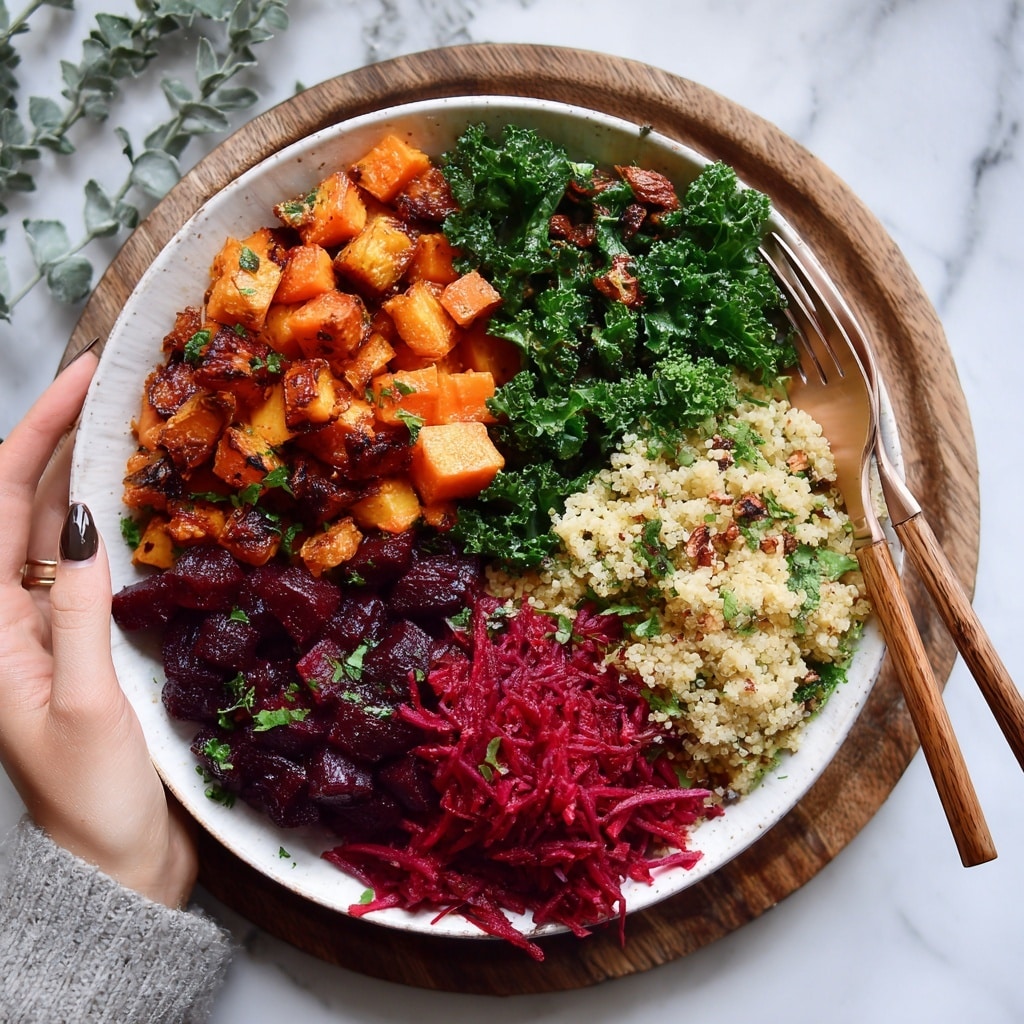 A bowl filled with a base layer of cooked grains with a soft, slightly shiny texture in light brown, topped with chunky pieces of roasted orange and deep red vegetables that are glistening and caramelized. Scattered over the top are small white crumbles of soft cheese and green pumpkin seeds, with some sprinkled herbs adding a touch of fresh green. The bowl is white and sits on a white marbled surface with a beige cloth partially shown underneath. photo taken with an iphone --ar 4:5 --v 7