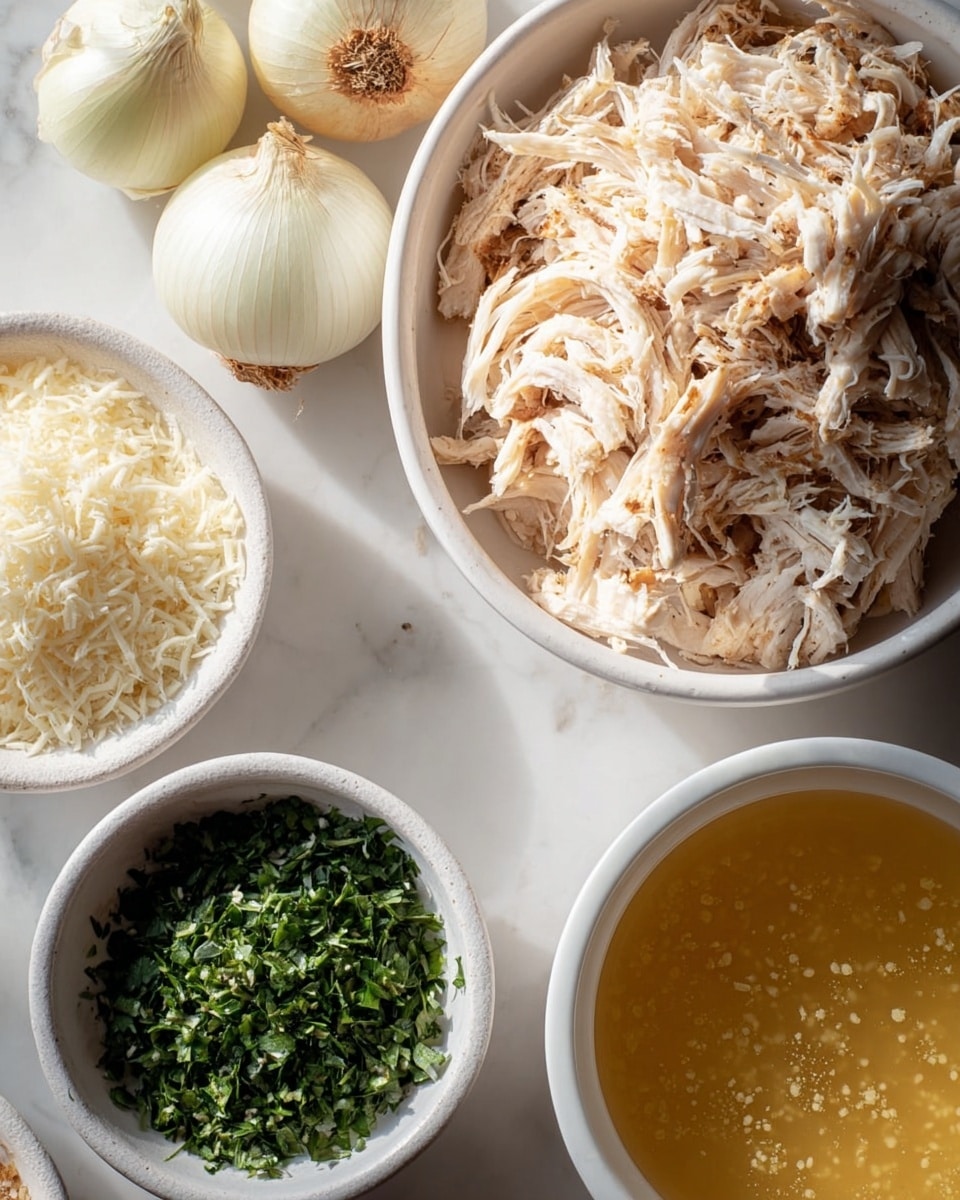 A white bowl filled with creamy chicken soup sits on a white marbled surface, topped with shredded chicken pieces and small green herb sprinkles. The soup has a smooth, light beige color with visible chunks of chicken and herbs floating on top. A piece of golden-brown toasted bread is held by a woman's hand, partially dipped into the soup from the upper left side of the bowl. A silver spoon lies near the bowl on a white cloth napkin. The overall scene has a cozy, warm feel. photo taken with an iphone --ar 4:5 --v 7