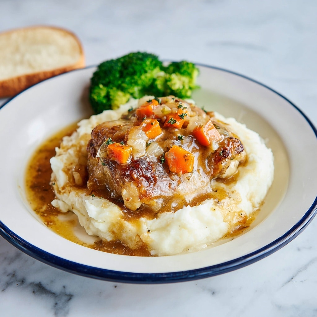 The image shows a pan with five cooked chicken thighs in a rich sauce. Each chicken piece has a golden-brown skin and is topped with small chunks of orange carrots and yellow onion. Bright green parsley leaves are scattered on top of the chicken and sauce, with a sprig of thyme resting on the chicken near the center. The sauce is a thick orange-brown color, filling the pan around the chicken. The pan has a visible black handle, and the background is a white marbled surface. Photo taken with an iphone --ar 4:5 --v 7