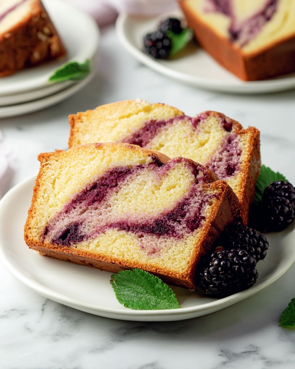 A rectangular loaf cake sits on a white plate on a white marbled surface. The cake has a golden-brown base with a smooth, shiny purple glaze dripping down the sides. On top, there are two glossy blackberries placed in the center. Another blackberry and green leaves rest on the plate beside the cake. In the background, a purple cloth adds a soft texture. Photo taken with an iphone --ar 4:5 --v 7